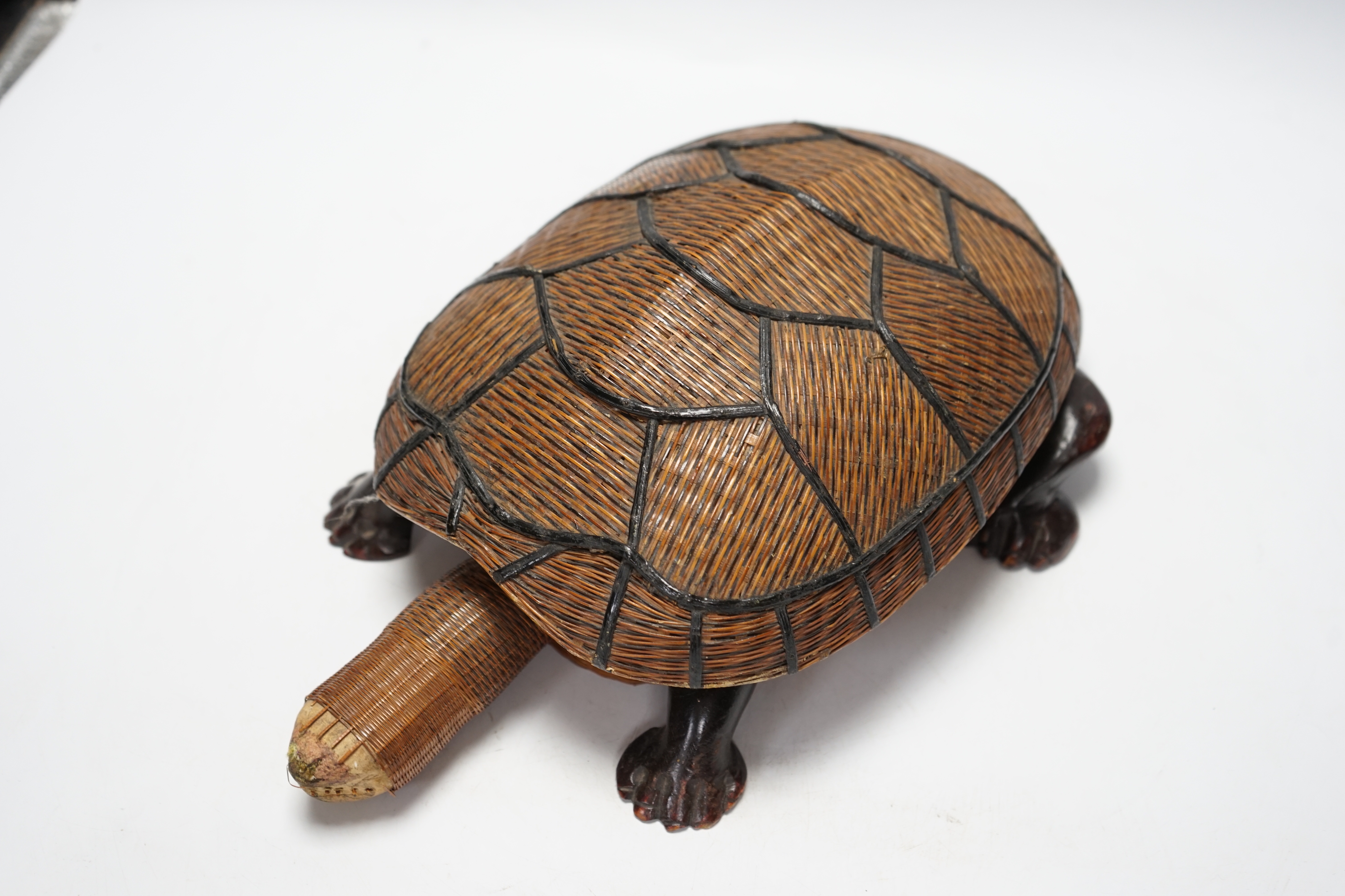 A collection of Chinese Soapstone carvings and a straw woven novelty tortoise shaped basket, basket 35cm long